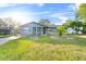 Newly renovated house with a gray exterior and a well-maintained lawn at 2108 Lemon St, Haines City, FL 33844