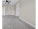 Well-lit bedroom with ceiling fan, carpet, and ample closet space at 2108 Lemon St, Haines City, FL 33844
