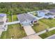 One-story home with gray siding, solar panels, and fenced backyard at 356 Citrine Loop, Kissimmee, FL 34758