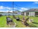 Large backyard with string lights, fire pit, and seating area at 356 Citrine Loop, Kissimmee, FL 34758
