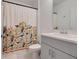 Clean bathroom with a bird-themed shower curtain and a single vanity at 356 Citrine Loop, Kissimmee, FL 34758