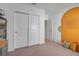 Bright bedroom with double doors and a colorful accent wall at 356 Citrine Loop, Kissimmee, FL 34758
