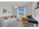 Charming bedroom with daybed, desk, and large window with natural light at 356 Citrine Loop, Kissimmee, FL 34758
