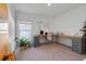 Spacious home office with an L-shaped desk and ample natural light at 356 Citrine Loop, Kissimmee, FL 34758