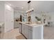 Spacious kitchen with island, stainless steel appliances, and white cabinets at 356 Citrine Loop, Kissimmee, FL 34758