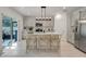 Modern kitchen with island, stainless steel appliances, and white quartz countertops at 356 Citrine Loop, Kissimmee, FL 34758