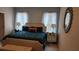 Serene bedroom with a comfortable bed and mirrored furniture at 4317 Acorn Ct, Davenport, FL 33837
