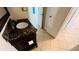 Small bathroom with granite vanity and tile floor at 5773 Gatlin Ave # 627, Orlando, FL 32822