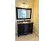 Bathroom features granite vanity, large mirror, and tile floor at 5773 Gatlin Ave # 627, Orlando, FL 32822