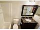 Bathroom with shower/tub combo, granite vanity, and tile floor at 5773 Gatlin Ave # 627, Orlando, FL 32822