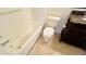 Bathroom with shower/tub combo, granite vanity, and tile floor at 5773 Gatlin Ave # 627, Orlando, FL 32822