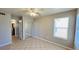 Bright bedroom with mirrored closet and ceiling fan at 5773 Gatlin Ave # 627, Orlando, FL 32822