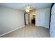 Bright bedroom with tile flooring and ceiling fan at 5773 Gatlin Ave # 627, Orlando, FL 32822