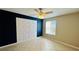 Bedroom with unique geometric wall accent and ceiling fan at 5773 Gatlin Ave # 627, Orlando, FL 32822
