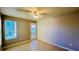 Bedroom with tile flooring, ceiling fan, and French door at 5773 Gatlin Ave # 627, Orlando, FL 32822