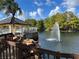 Community features a pond with fountain and gazebo at 5773 Gatlin Ave # 627, Orlando, FL 32822