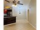 Open dining area with tile floors and modern lighting at 5773 Gatlin Ave # 627, Orlando, FL 32822