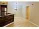 Dining area with tile floors and kitchen bar at 5773 Gatlin Ave # 627, Orlando, FL 32822