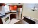 Modern kitchen featuring stainless steel appliances and wood cabinets at 5773 Gatlin Ave # 627, Orlando, FL 32822