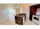 Kitchen with breakfast bar and granite countertops at 5773 Gatlin Ave # 627, Orlando, FL 32822