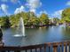 Scenic lake view with fountain and lush landscaping at 5773 Gatlin Ave # 627, Orlando, FL 32822