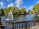Scenic lake view with fountain and lush landscaping at 5773 Gatlin Ave # 627, Orlando, FL 32822