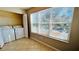 Laundry area with washer, dryer, and large window at 5773 Gatlin Ave # 627, Orlando, FL 32822