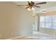 Bright living room with tile floors and ceiling fan at 5773 Gatlin Ave # 627, Orlando, FL 32822
