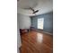 Spacious bedroom with hardwood floors and ceiling fan at 824 San Pedro Ct, Kissimmee, FL 34758