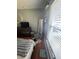 Bedroom with wood floors, large window and full bed at 824 San Pedro Ct, Kissimmee, FL 34758