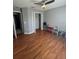 Bedroom with hardwood floors, closet, and ceiling fan at 824 San Pedro Ct, Kissimmee, FL 34758
