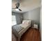 Well-lit bedroom with wood floors and a full-size bed at 824 San Pedro Ct, Kissimmee, FL 34758