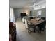 Open concept dining area with a large wooden table at 824 San Pedro Ct, Kissimmee, FL 34758
