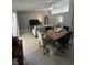 Open concept dining area with a wood table and seating for four at 824 San Pedro Ct, Kissimmee, FL 34758