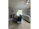 Bright dining room featuring a large wooden table with seating for six at 824 San Pedro Ct, Kissimmee, FL 34758