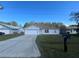 Cute one-story home with a large driveway and well-maintained lawn at 824 San Pedro Ct, Kissimmee, FL 34758