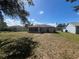 House exterior showcasing back of house with screened patio at 824 San Pedro Ct, Kissimmee, FL 34758