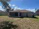 House exterior showcasing back of house with screened patio at 824 San Pedro Ct, Kissimmee, FL 34758