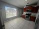 Bright kitchen with stainless steel appliances and light tile floors at 824 San Pedro Ct, Kissimmee, FL 34758