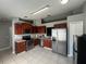 Kitchen features stainless steel appliances and ample wood cabinets at 824 San Pedro Ct, Kissimmee, FL 34758