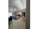Spacious living room with tile floors, large sectional sofa, and TV at 824 San Pedro Ct, Kissimmee, FL 34758