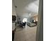Living room features a sectional sofa and view into dining area at 824 San Pedro Ct, Kissimmee, FL 34758