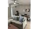 Living area with comfortable sectional sofa and wood coffee table at 824 San Pedro Ct, Kissimmee, FL 34758