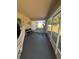 Screened porch with hanging chair and backyard view at 824 San Pedro Ct, Kissimmee, FL 34758