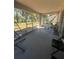 Relaxing screened porch with hammock and seating at 824 San Pedro Ct, Kissimmee, FL 34758