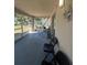 Covered patio with seating and a hammock at 824 San Pedro Ct, Kissimmee, FL 34758