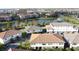 Community view showcasing lakefront townhomes and landscaping at 10090 Sunnifa Aly, Orlando, FL 32832