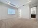 Spacious bedroom with neutral carpeting and ensuite bathroom access at 10090 Sunnifa Aly, Orlando, FL 32832