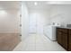 Laundry room with washer, dryer, and built-in cabinets at 10090 Sunnifa Aly, Orlando, FL 32832
