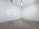 Simple bedroom with neutral carpeting and double doors at 10090 Sunnifa Aly, Orlando, FL 32832